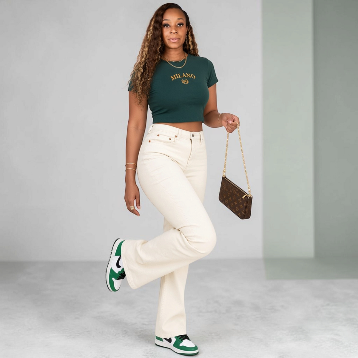 A Classy Chic Boutique forest green crop top with Milano embroidery, worn with cream jeans and green sneakers.